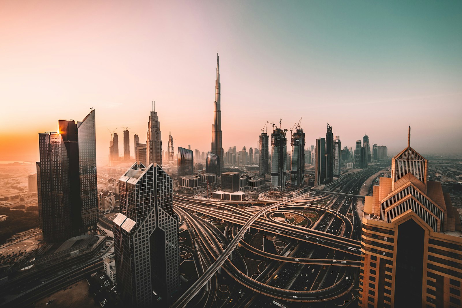 Burj Khalifa rising above the Dubai skyline at dusk