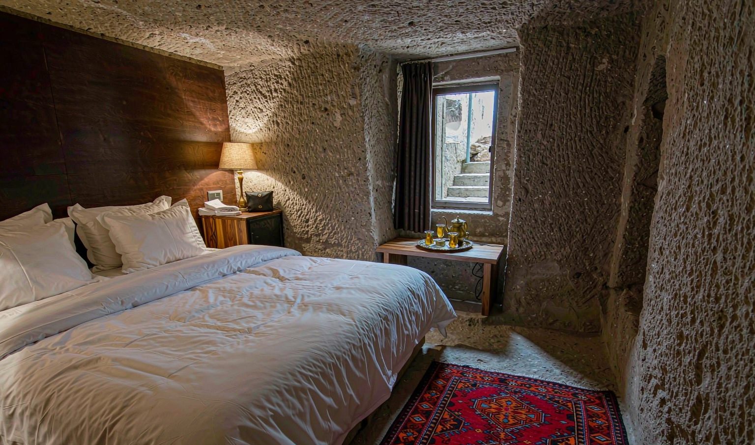 Cave hotel suite carved into rock in Göreme, Cappadocia