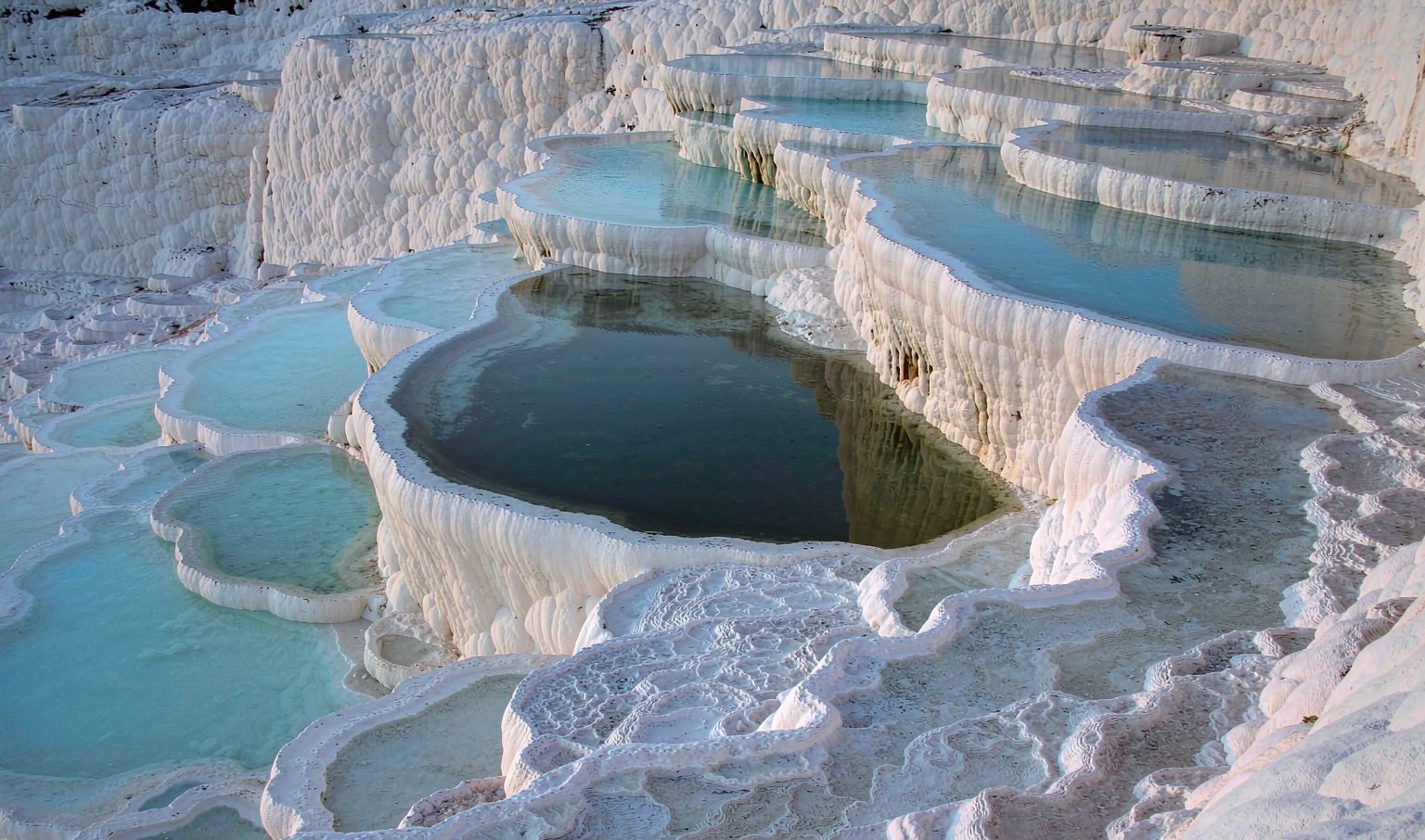 White travertine terraces and turquoise pools at Pamukkale