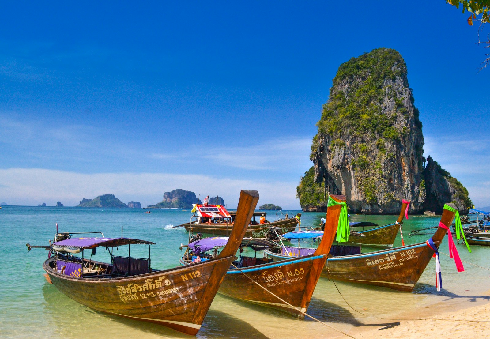 Longtail boats on turquoise water off the Thai islands